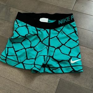 Blue and black Nike pros